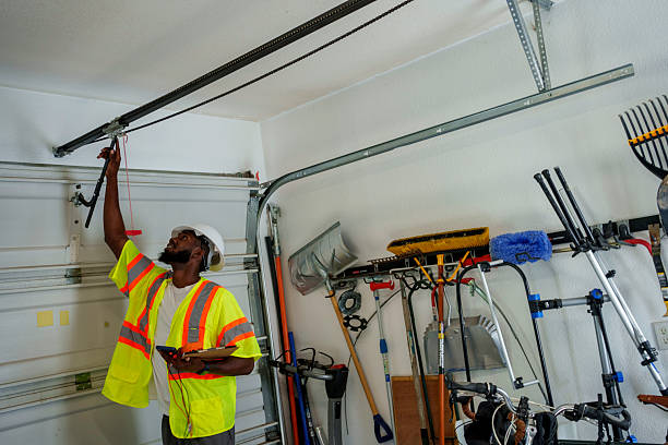 Professional Garage Door Installation technician working in Daytona Beach Shores, FL